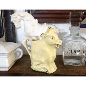 Pearl 635 Cow Creamer, trimmed with 22 kt gold, butter yellow color